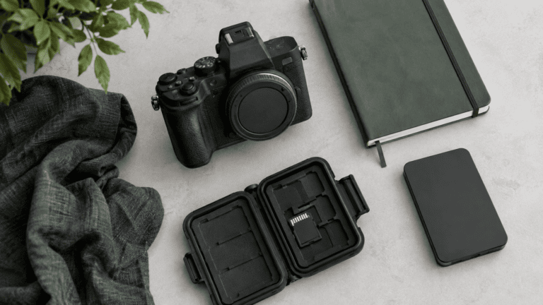 A powered-off camera, removed SD card in a case and separate portable drive.